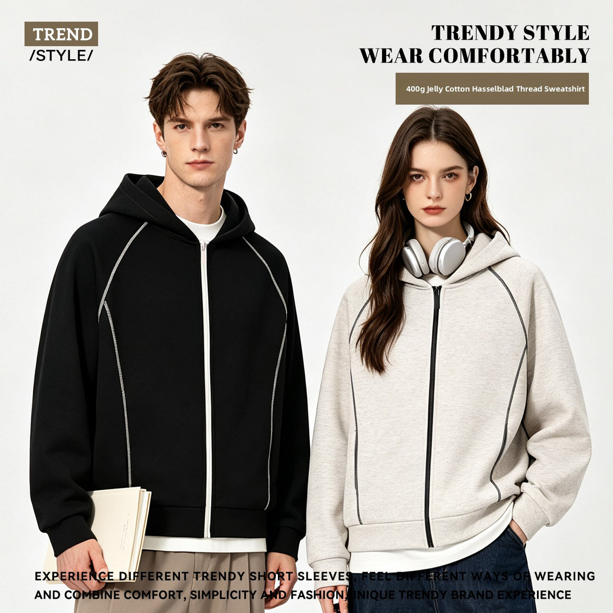 Man in a black zip hoodie and woman in a light grey zip hoodie, both with contrast topstitching on the sleeves