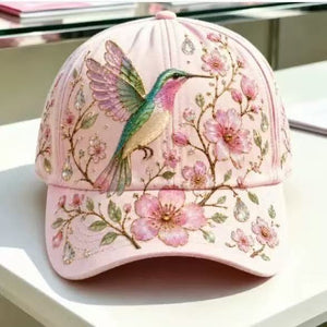 Floral print adjustable baseball cap shown from the front on a pale studio surface