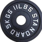 Cast iron barbell plate angled to show the textured edge and center sleeve hole