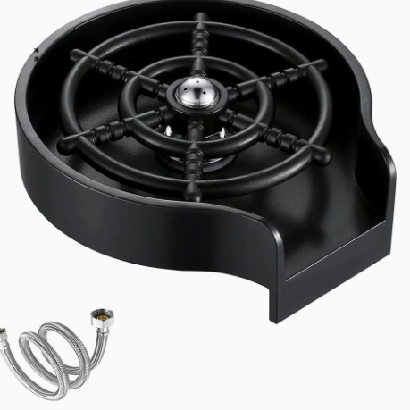 Overhead view of the round black glass rinser with central spring loaded nozzle
