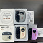 Three electric nail clipper units in gray, beige and purple with boxes, USB cables and printed manuals on a dark table