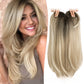 Blonde balayage synthetic hair topper on a model beside the straight piece held by its base