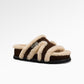 Camel suede fleece lined slide slipper viewed from the side with its lug sole