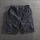 Men's cargo shorts shown flat with a part elasticated drawstring waist and a button fly