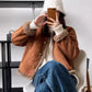 Brown cropped suede-look jacket with sherpa trim, front view on model