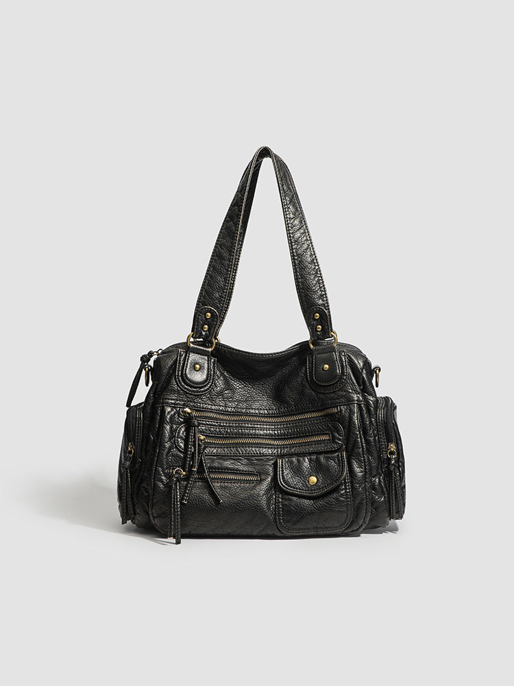 Vintage style PU motorcycle bag in black shown front view