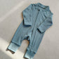 Hazy Blue zip front baby romper laid flat on a gray floor, image of the 90 cm, 18 to 24 months size option