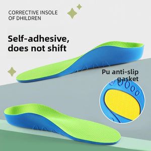Childrens cushioned PU arch support insole, breathable green top over a blue foam base, angled view