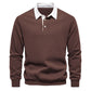 Side profile of the polo collar pullover showing the relaxed sleeve fit