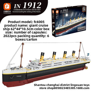 Titanic cruise liner brick model FC6005 with four funnels, built in black, red and cream, shown next to its box