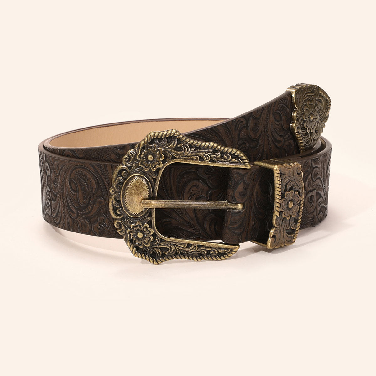 Full view of the vintage floral embossed wide belt with its ornate brass buckle