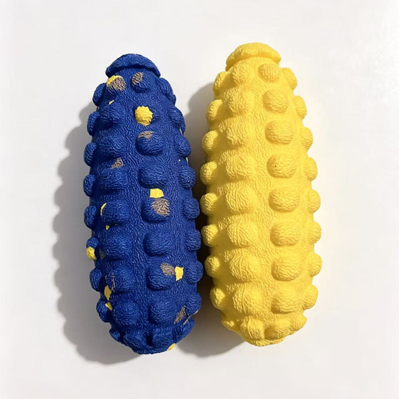 Blue and yellow bumpy corn cob shaped dog toys side by side on a white background, top view