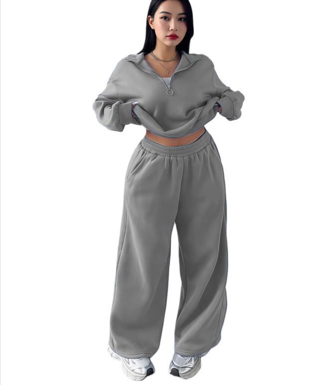 Light gray cropped half-zip sweatshirt and wide-leg sweatpants set on a model, size XL option