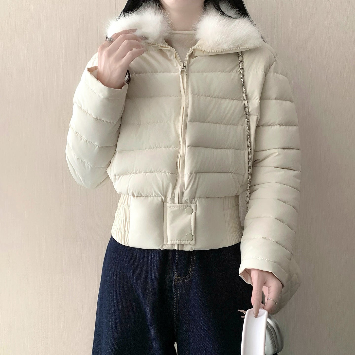 Elastic gathered hem and snap tab detail on the cropped padded puffer jacket