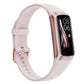 Pink smart bracelet with a rose gold case and a black touchscreen showing the time 08:06