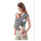 Grey cotton cross-back baby carrier worn on the front, baby held close against the chest