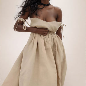 Front view of the one shoulder tie strap midi dress on a model in a bright room