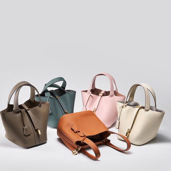 Leather bucket tote bag carried on the shoulder in a daily scene