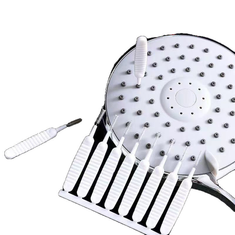 Mini nylon and wire cleaning brushes shown beside a white round showerhead being cleaned
