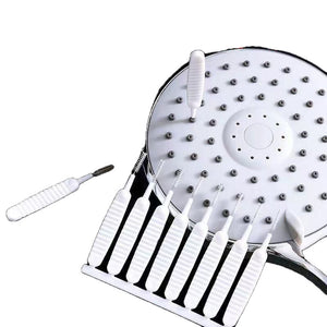 Mini nylon and wire cleaning brushes shown beside a white round showerhead being cleaned