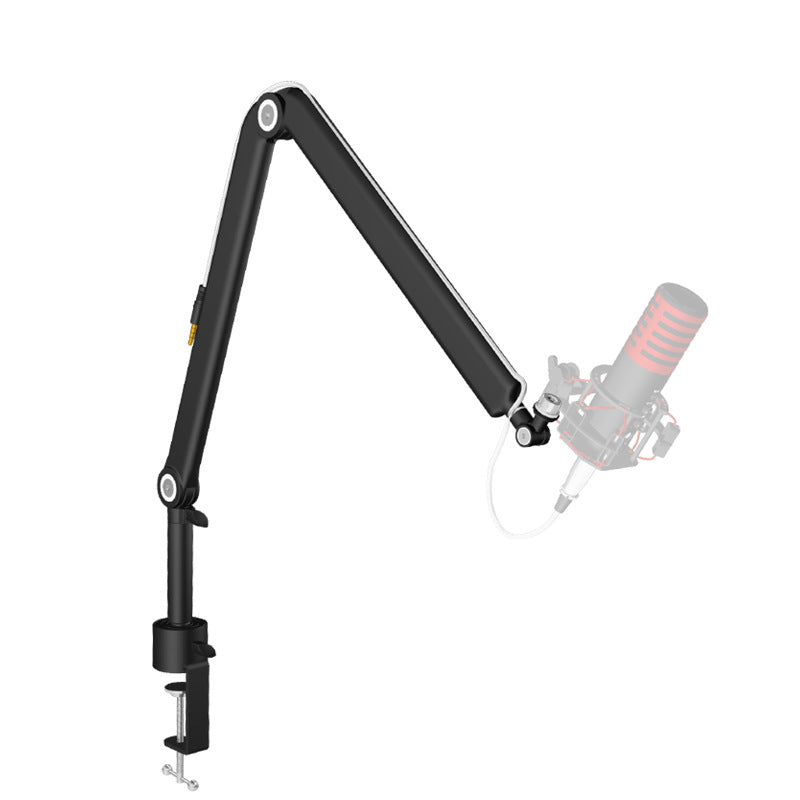 Black aluminum microphone boom arm curved down toward a ghost mic, clamp fixed at the desk edge