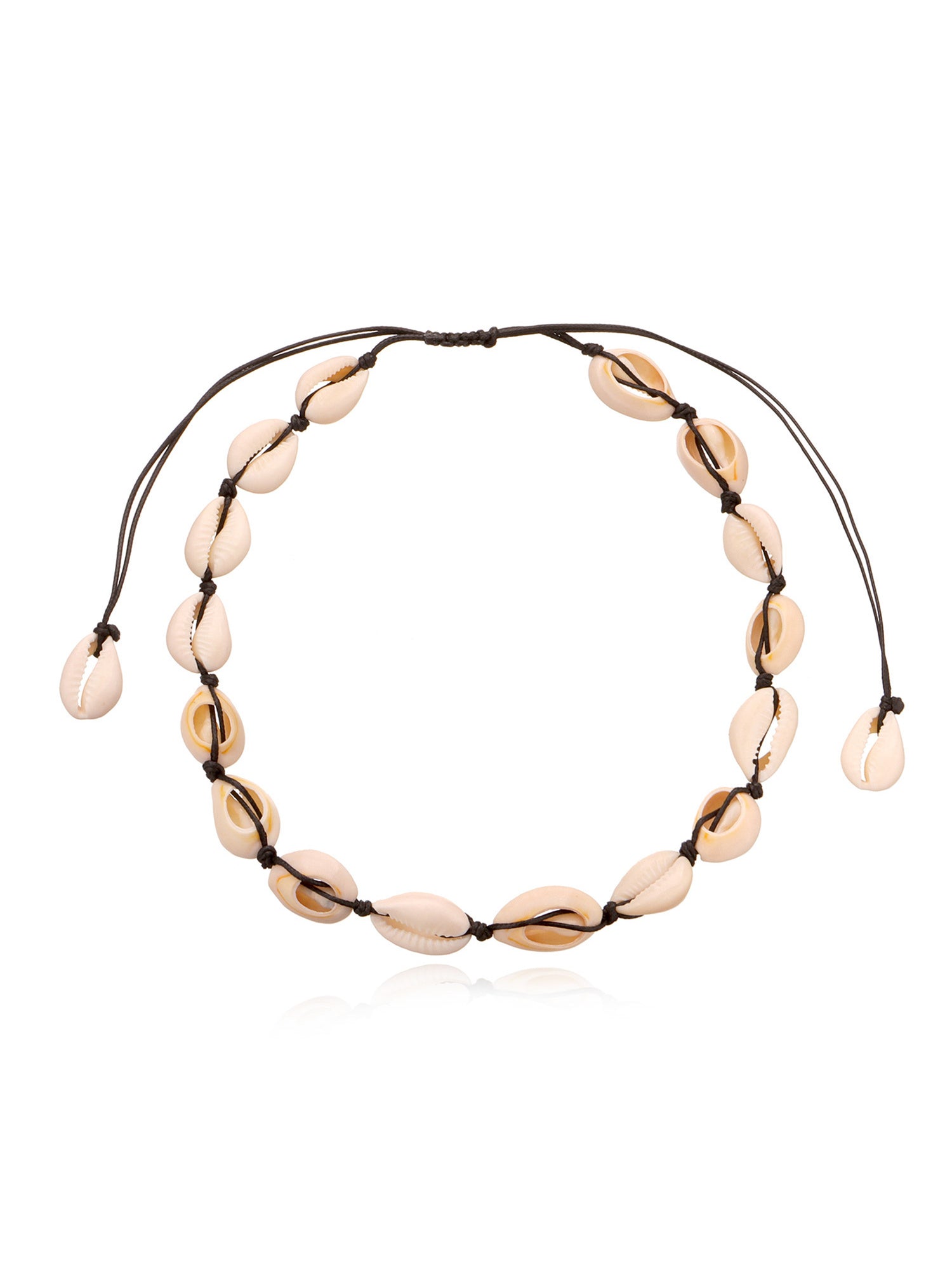 Cowrie shell choker on black knotted cord laid flat, sliding knot and shell tipped tails visible