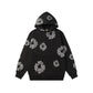 Cotton wreath print hoodie styled against a neutral plain backdrop
