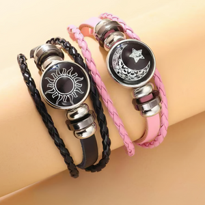Sun and moon cord bracelets worn side by side on a wrist showing braided strands and silver barrel beads