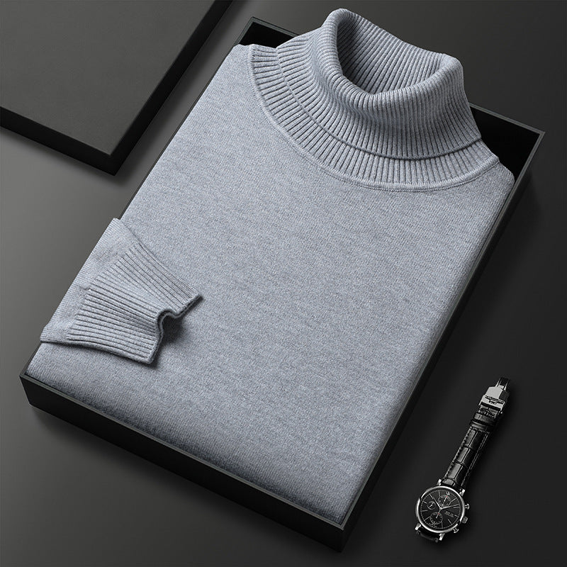 Men's slim-fit turtleneck sweater shown from the front on a model
