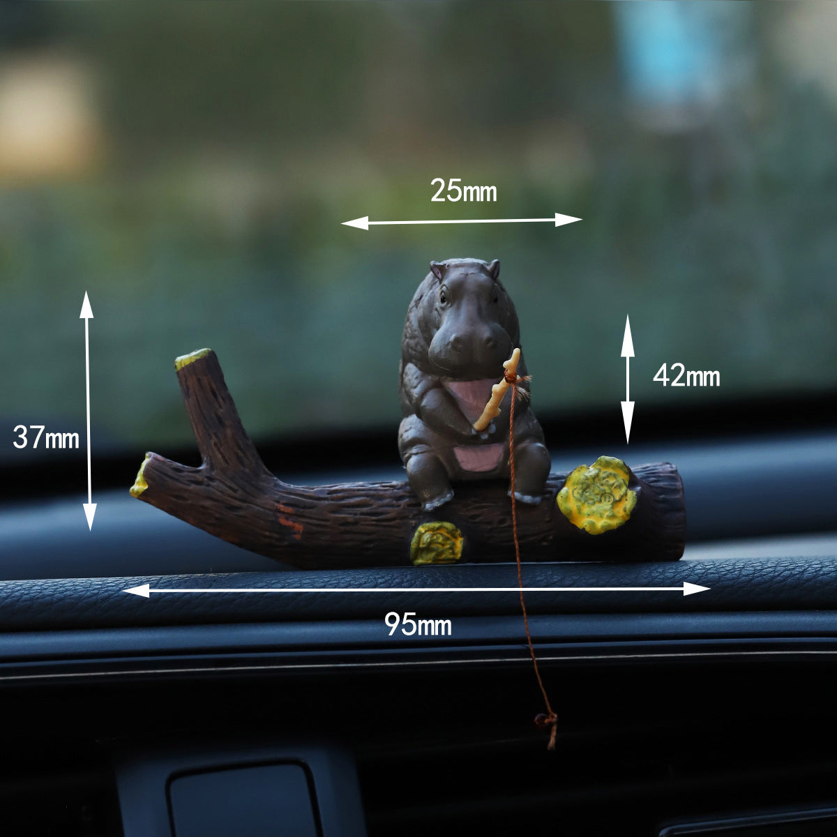 Grey hippo sitting on the resin branch with a rod, maker sizes marked 25 and 42 mm