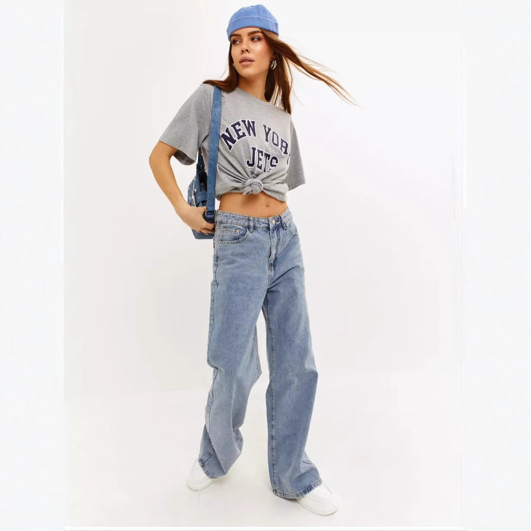 Full length light wash wide leg baggy jeans on model