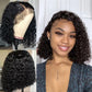 Woman wearing a short curly black synthetic lace front bob wig, close front view