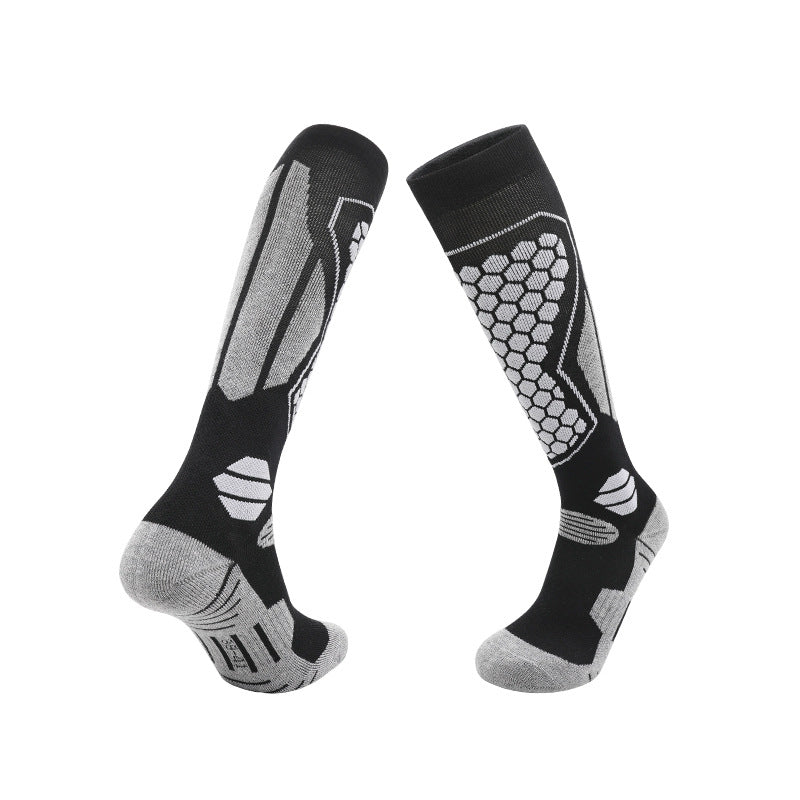Warm knee high ski socks in a merino wool blend with a cushioned sole, colourway pair