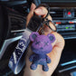 Color changing bear charm showing a paler gray shade in bright light