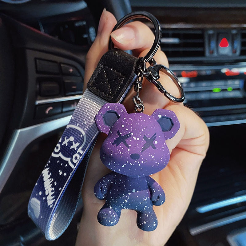 Color changing bear charm showing a paler gray shade in bright light