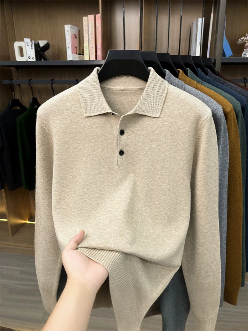 Khaki beige long sleeve knit polo shirt on a hanger with ribbed hem, fabric held by hand