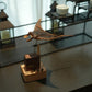 Wooden figurine styled on a desk corner as a small sculptural accent