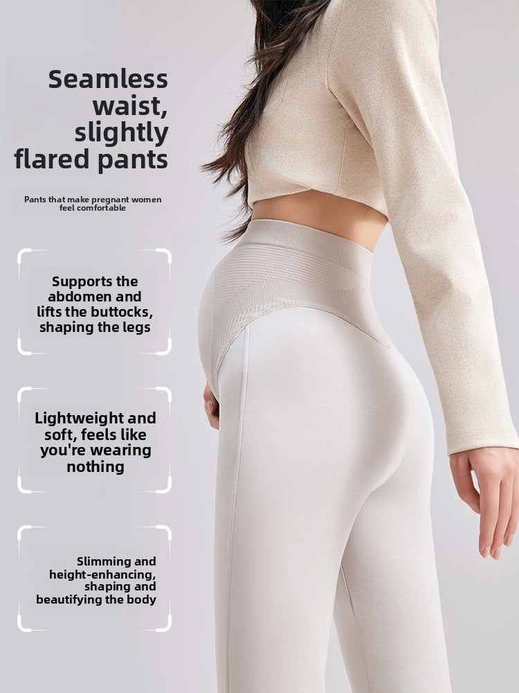 Rear close view of beige maternity bell-bottom pants showing the seamless high-waist panel