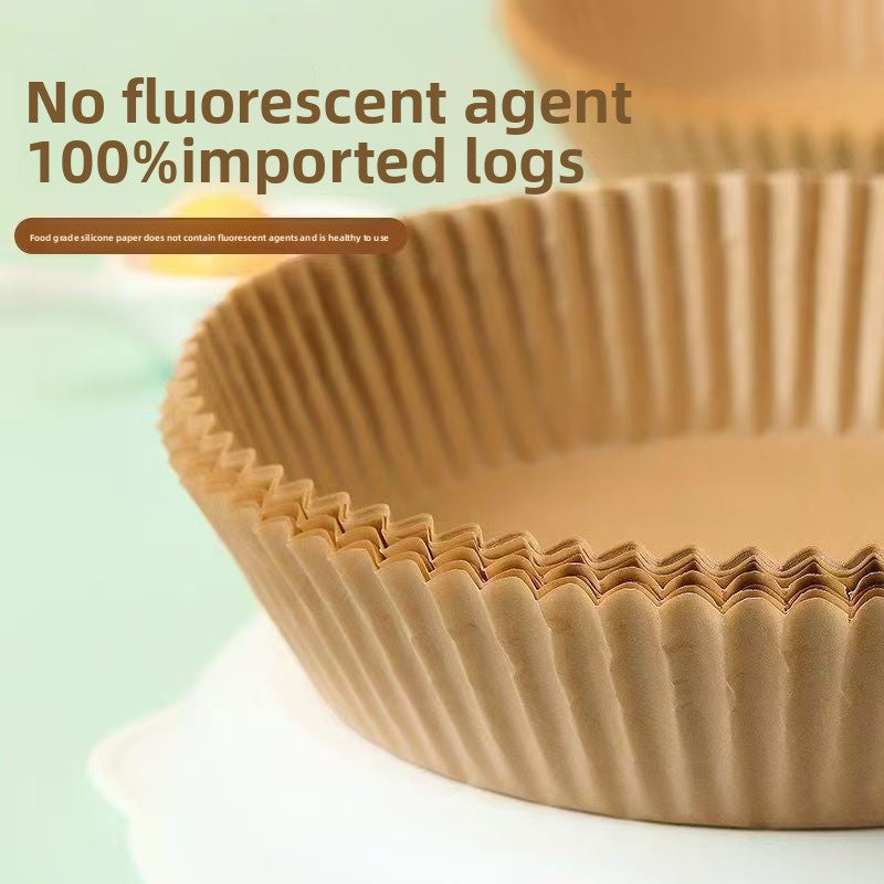 Round and square air fryer parchment liners arranged on a surface