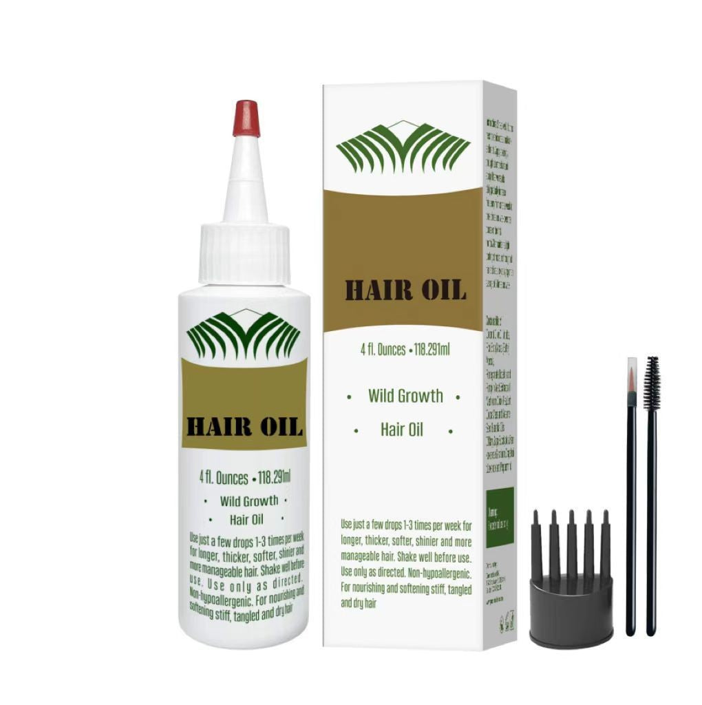 White botanical hair oil bottle and box with a green leaf motif, scalp comb and two spoolie brushes