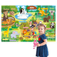 Girl beside a zoo and world animal felt story board covered in labelled felt animal pieces