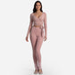 Close view of the front cross tie waist detail on the wrap top