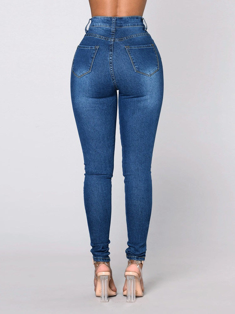 Light blue stretch skinny jeans, back view showing back pockets and stitching on model