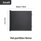 Black roll up pet gate marked small, about 110 cm wide and 78 cm high, on a grey background