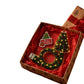 Tree shaped LED Christmas light and wreath shaped USB loop in an open gift box on a white background