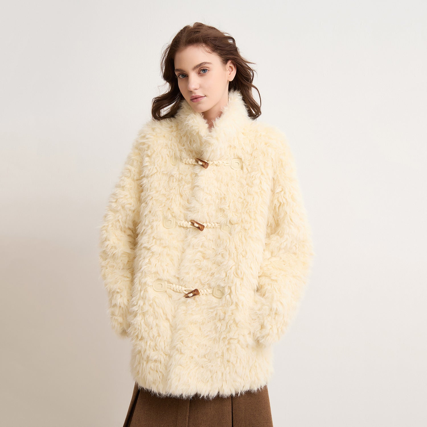 Faux Shearling Winter Coat | layered with denim and boots