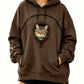 Brown oversized fleece hoodie on a woman with a cat looking out of the round drawstring pocket on the chest
