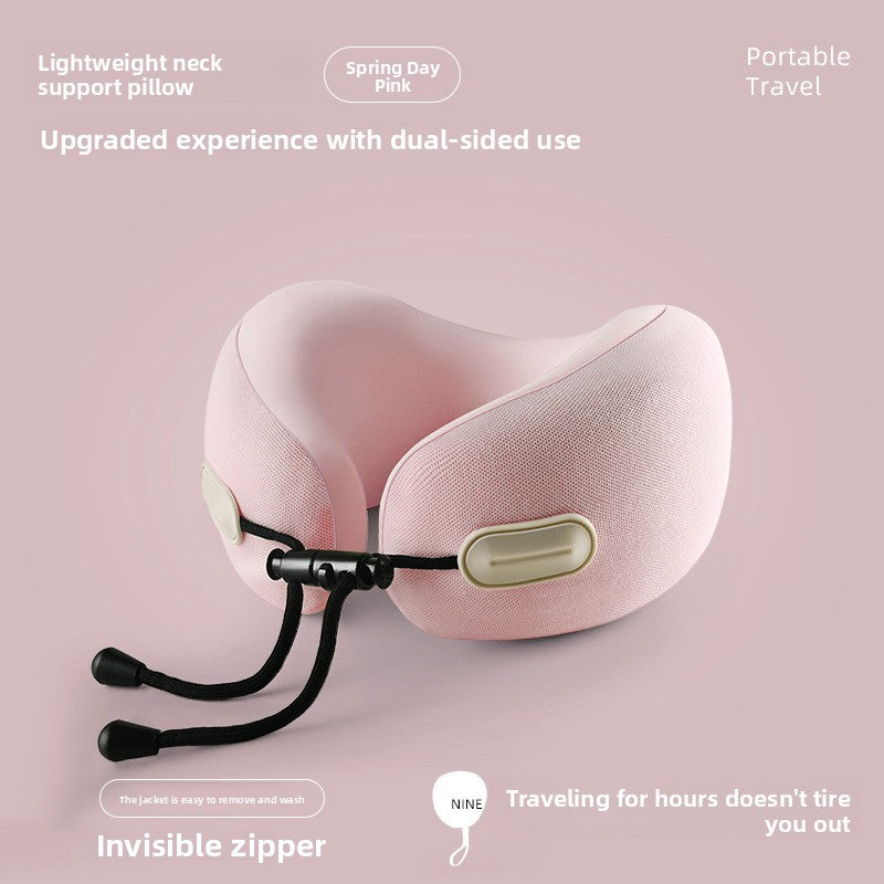 Memory foam travel neck pillow shown from the side, its U shape and toggle cinch visible