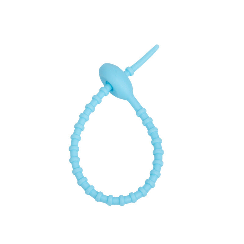 Close view of the ridged silicone strap and the tadpole head that holds the loop