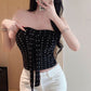 Black ditsy floral strapless tube top with a center front tie bow and ruched side panels